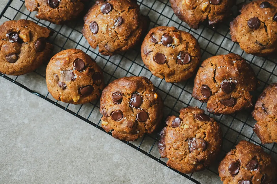 Chocolate chip cookies cooling on a wire rack